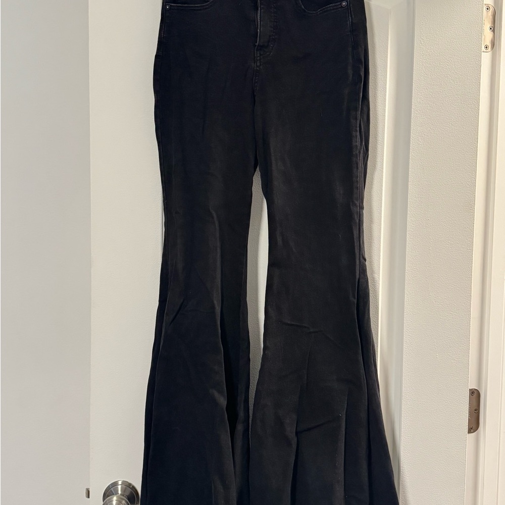 We the Free Free People Black Flare Jeans with tie in the back.